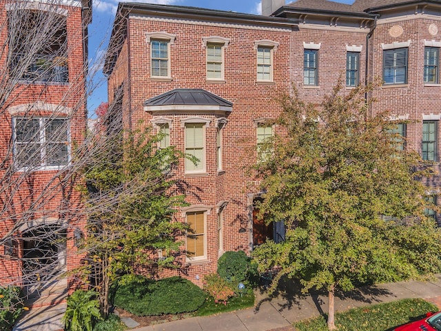 view of front of home with brick siding