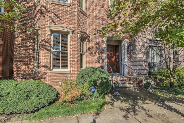 property entrance with brick siding