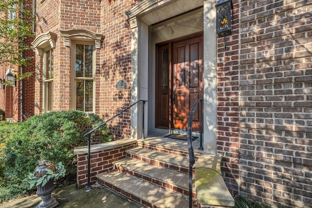 entrance to property with brick siding