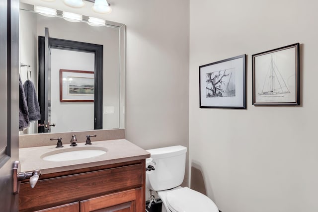 half bath with toilet and vanity