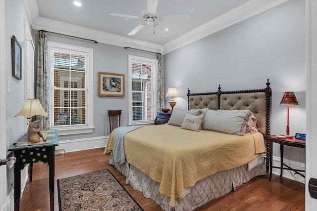 bedroom with recessed lighting, crown molding, baseboards, and wood finished floors