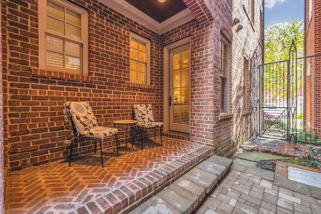 view of patio featuring a gate