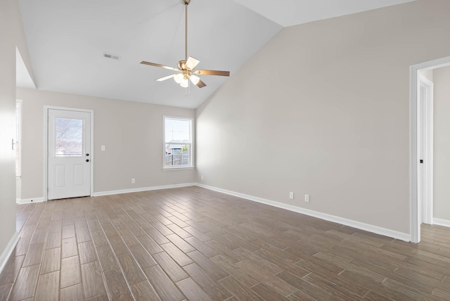 interior space featuring a ceiling fan, dark wood-style floors, visible vents, and baseboards