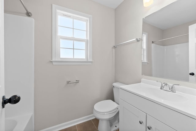 bathroom featuring toilet, tile patterned flooring, shower / bath combination, baseboards, and vanity