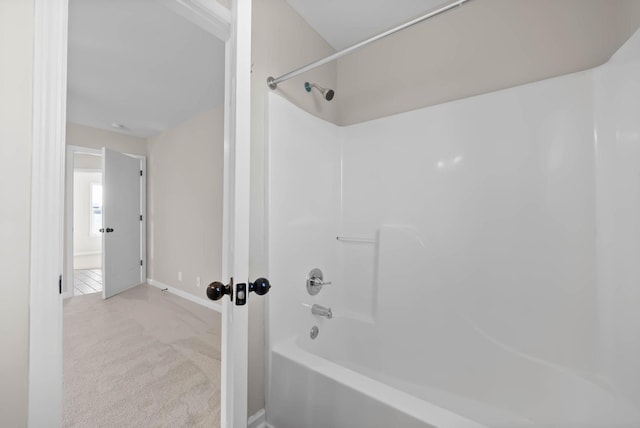 full bathroom with shower / tub combination and baseboards