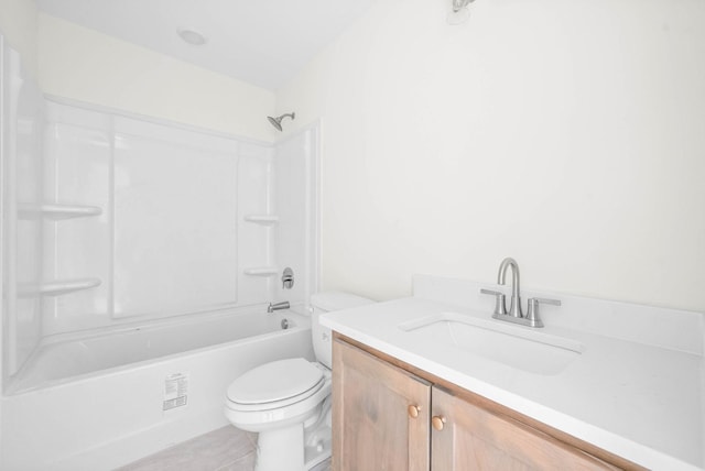 full bath featuring vanity, toilet, tile patterned flooring, and shower / washtub combination