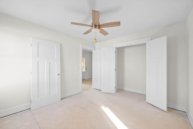 unfurnished bedroom featuring baseboards and ceiling fan