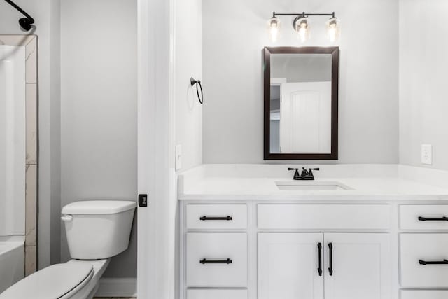 bathroom with toilet and vanity