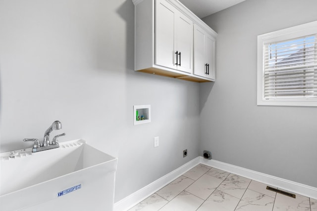 laundry room with visible vents, baseboards, washer hookup, marble finish floor, and a sink