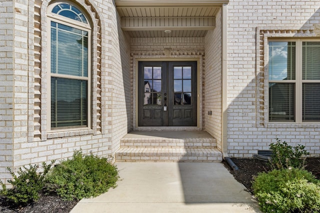 entrance to property with french doors and brick siding