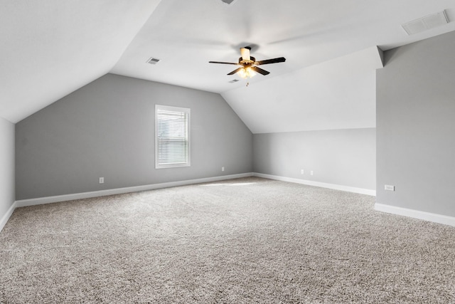 bonus room featuring lofted ceiling, visible vents, and carpet floors