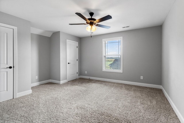 unfurnished bedroom with visible vents, baseboards, carpet, and ceiling fan