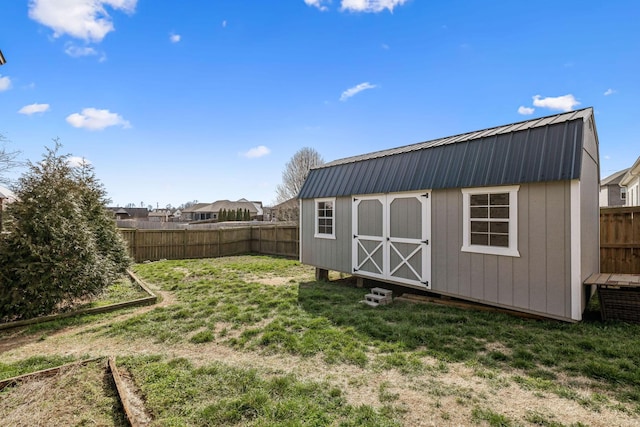 view of shed featuring a fenced backyard