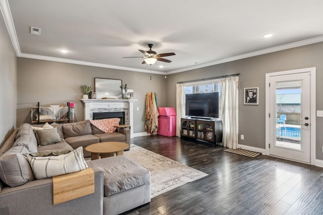 living area featuring dark wood-style floors, visible vents, and baseboards