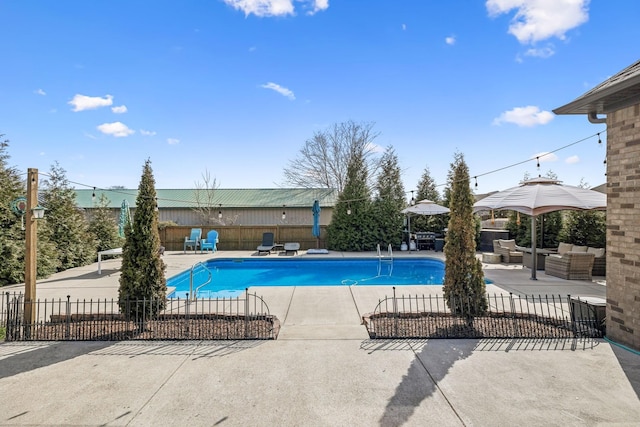 view of pool with a patio area, a fenced in pool, an outdoor hangout area, and fence