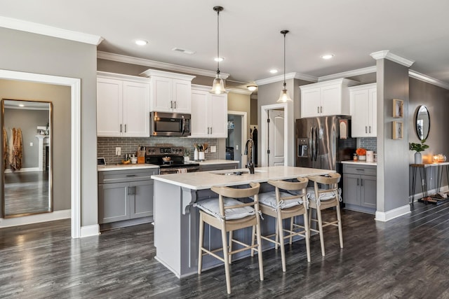 kitchen with dark wood-style flooring, visible vents, appliances with stainless steel finishes, and gray cabinetry