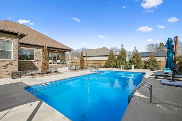 view of pool featuring a fenced in pool, a patio, and a fenced backyard