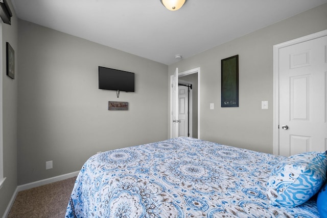 carpeted bedroom with baseboards