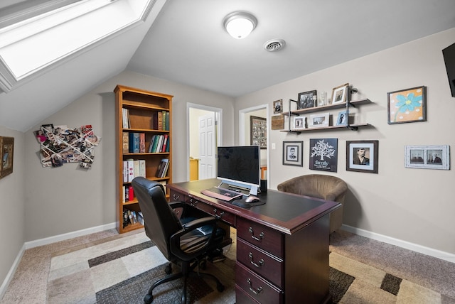 office space featuring lofted ceiling, light colored carpet, visible vents, and baseboards