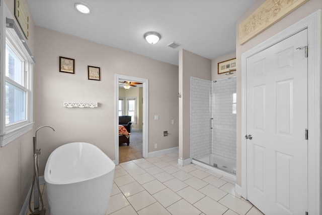 ensuite bathroom with visible vents, ensuite bathroom, a shower stall, baseboards, and a soaking tub