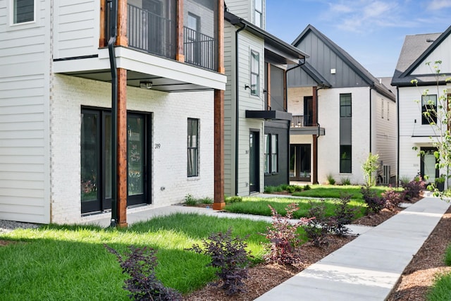 exterior space featuring brick siding