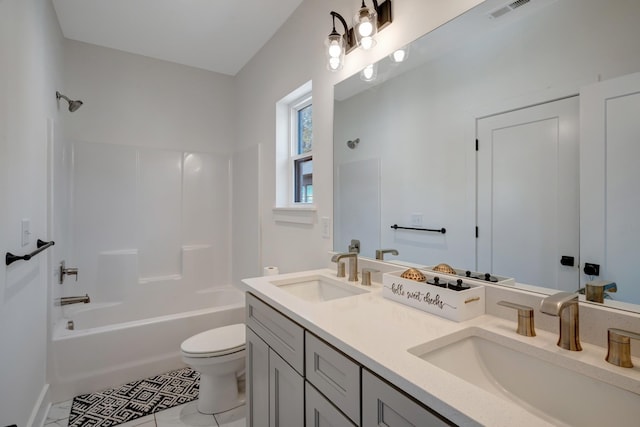 bathroom with visible vents, toilet, shower / tub combination, and a sink