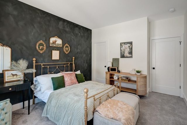 bedroom featuring carpet flooring and baseboards