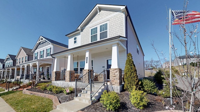 craftsman house with a porch and a residential view