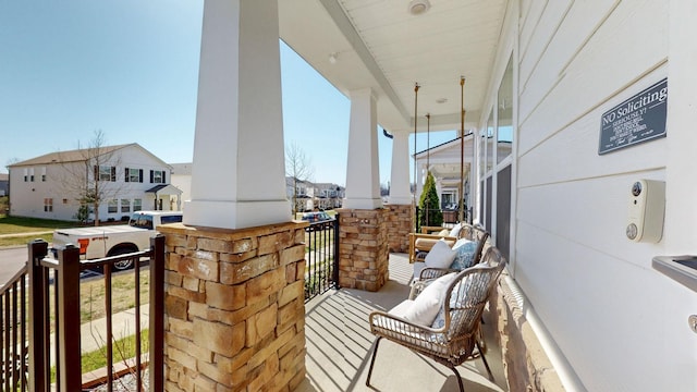 balcony with a residential view and covered porch