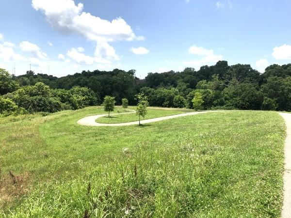 view of community featuring a forest view
