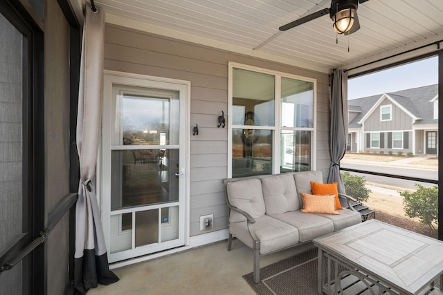 sunroom / solarium featuring wooden ceiling and ceiling fan