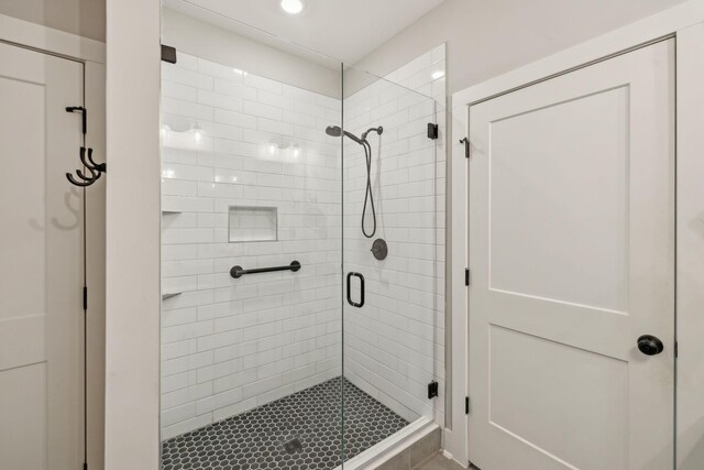 bathroom featuring a shower stall