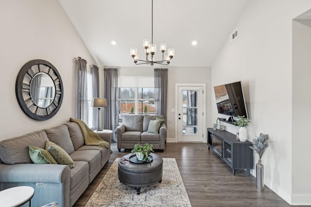 living room featuring visible vents, baseboards, dark wood-type flooring, and a notable chandelier