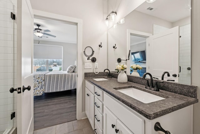 full bathroom with a sink, visible vents, double vanity, and ensuite bathroom