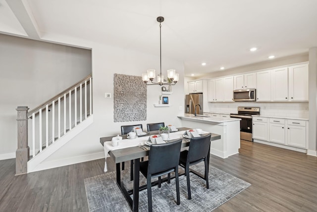 dining area featuring baseboards, stairs, recessed lighting, dark wood-style floors, and a notable chandelier