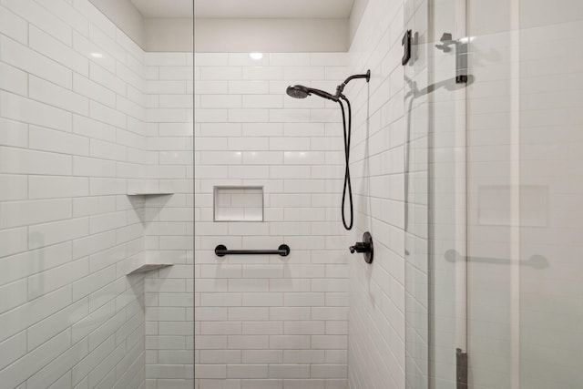 full bath featuring a shower stall