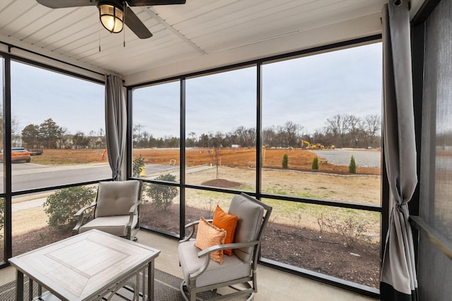 sunroom featuring a ceiling fan