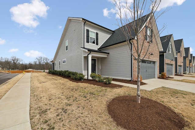 view of front of home featuring concrete driveway, brick siding, and a garage