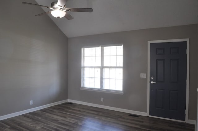 entrance foyer with visible vents, dark wood-type flooring, baseboards, ceiling fan, and vaulted ceiling