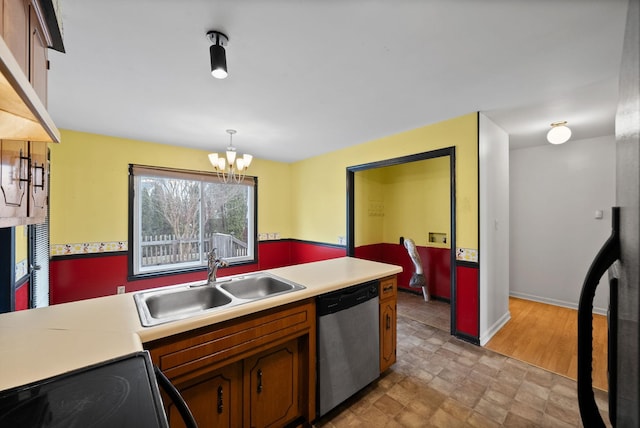 kitchen featuring a sink, dishwasher, brown cabinetry, and light countertops