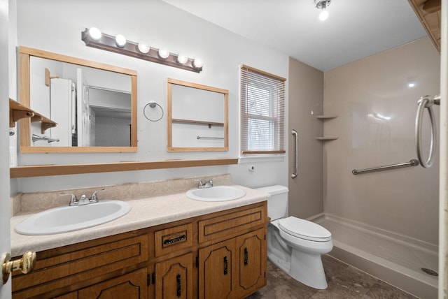 bathroom with double vanity, a walk in shower, toilet, and a sink