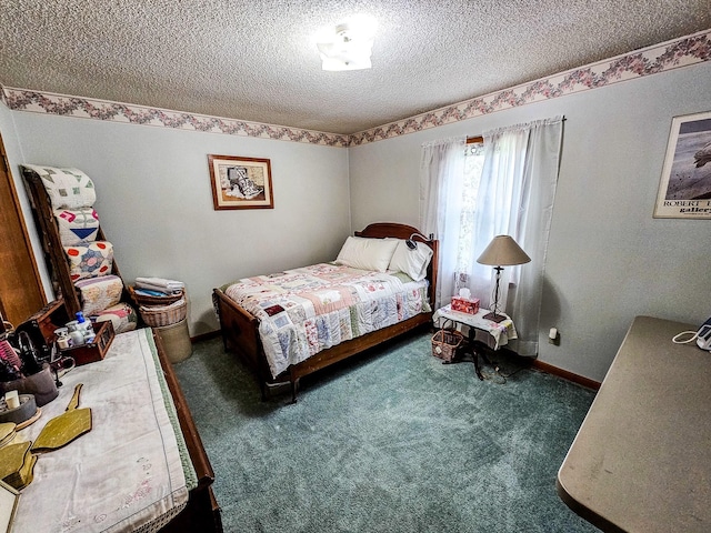 bedroom with carpet flooring, baseboards, and a textured ceiling