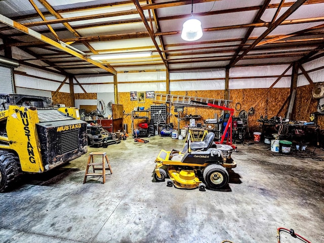 garage featuring a workshop area and metal wall