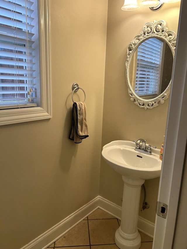 bathroom with tile patterned flooring and baseboards