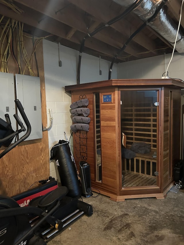 workout room featuring concrete block wall