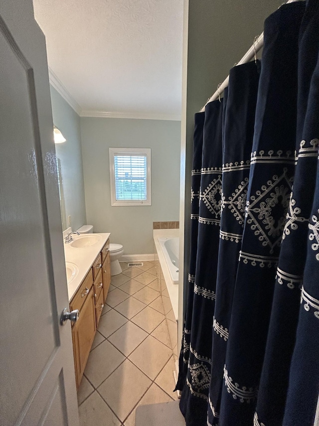 bathroom featuring vanity, baseboards, ornamental molding, tile patterned flooring, and toilet