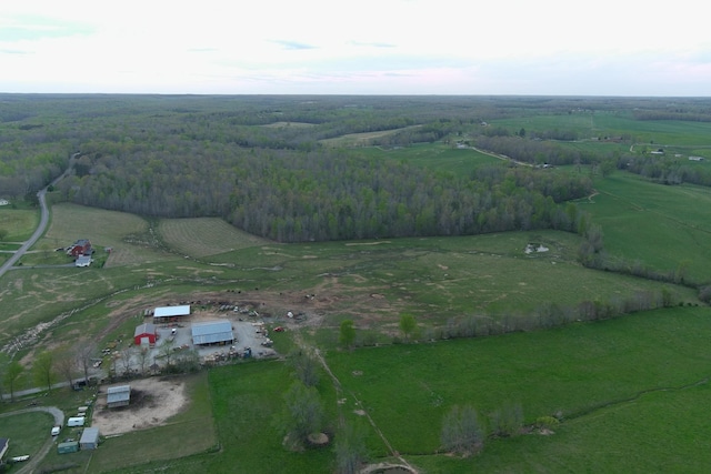 drone / aerial view featuring a rural view and a forest view