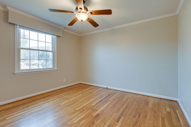 spare room with ceiling fan, light wood-style floors, baseboards, and ornamental molding