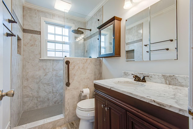 full bathroom with vanity, walk in shower, toilet, and ornamental molding