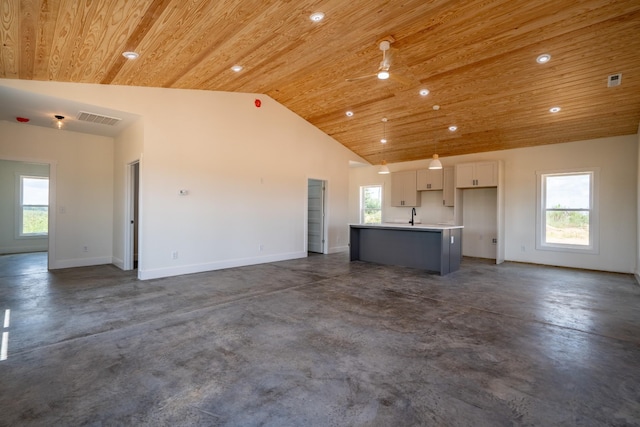 241 Springer, Hohenwald, TN 38462 - unfurnished living room featuring wood ceiling, finished concrete flooring, recessed lighting, baseboards, and a sink